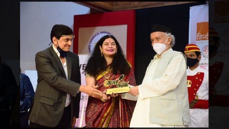 Dr. Trivedi receiving Yatha Katha Film Festival Award 2022 from Shri Bhagat Singh Koshyari at MNWC
